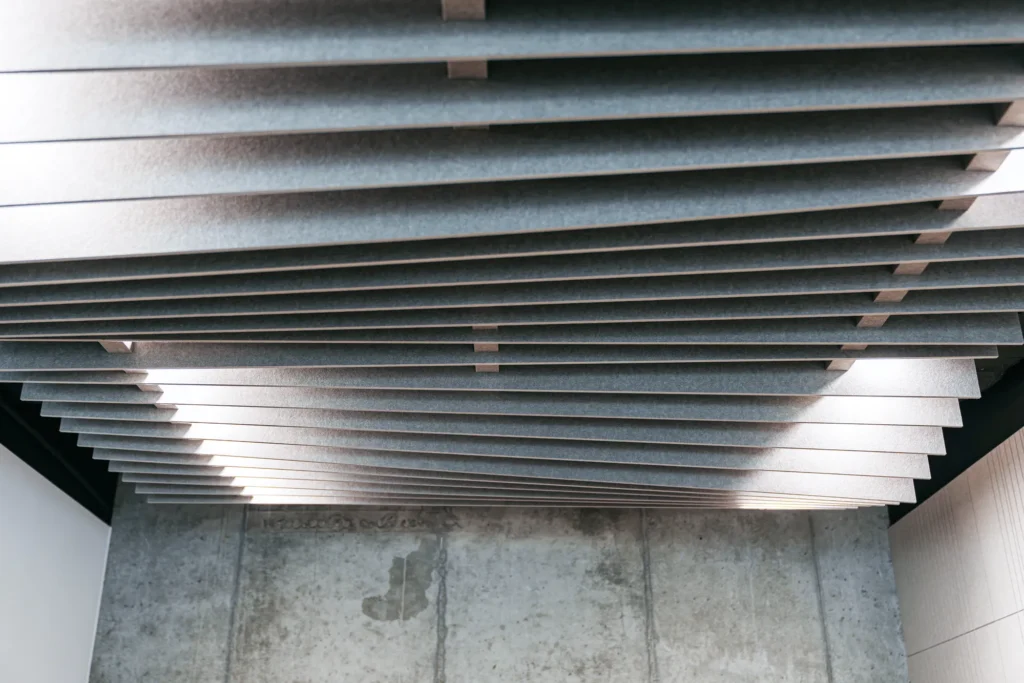 A suspended ceiling made of felt slats in the MDD conference room in Kraków